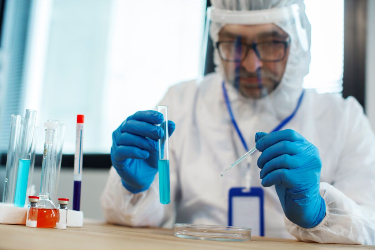 Scientist working on an experiment wearing PPE